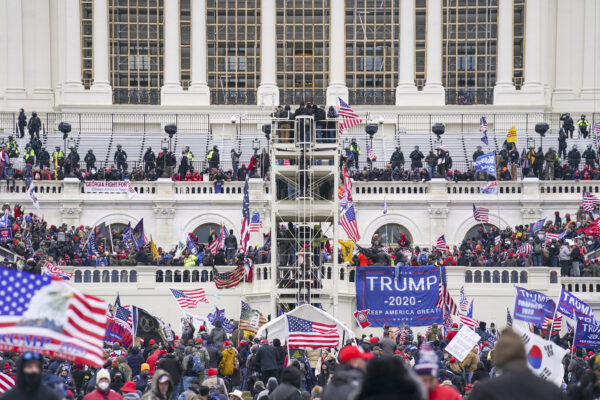 Trump supporters gather outside the Capitol, Wednesday, Jan. 6, 2021, in Washington. As Congress prepares to affirm President-elect Joe Biden’s victory, thousands of people have gathered to show their support for President Donald Trump and his claims of election fraud. (AP Photo/John Minchillo)