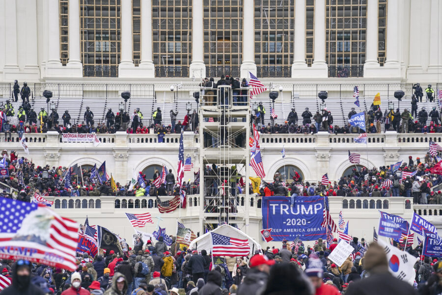 Trump supporters gather outside the Capitol, Wednesday, Jan. 6, 2021, in Washington. As Congress prepares to affirm President-elect Joe Biden’s victory, thousands of people have gathered to show their support for President Donald Trump and his claims of election fraud. (AP Photo/John Minchillo)