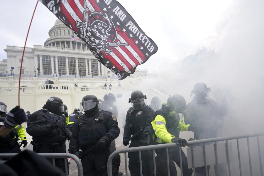 Police hold off Trump supporters who tried to break through a police barrier, Wednesday, Jan. 6, 2021, at the Capitol in Washington. As Congress prepares to affirm President-elect Joe Biden’s victory, thousands of people have gathered to show their support for President Donald Trump and his claims of election fraud. (AP Photo/Julio Cortez)