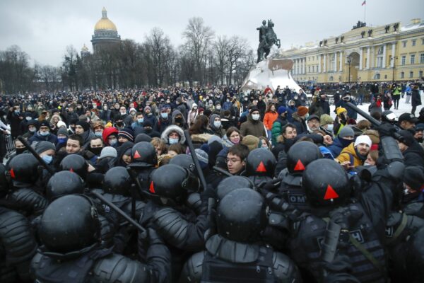 People clash with police during a protest against the jailing of opposition leader Alexei Navalny in St.Petersburg, Russia, Saturday, Jan. 23, 2021. Russian police on Saturday arrested hundreds of protesters who took to the streets in temperatures as low as minus-50 C (minus-58 F) to demand the release of Alexei Navalny, the country’s top opposition figure. A Navalny, President Vladimir Putin’s most prominent foe, was arrested on Jan. 17 when he returned to Moscow from Germany, where he had spent five months recovering from a severe nerve-agent poisoning that he blames on the Kremlin. (AP Photo/Dmitri Lovetsky)