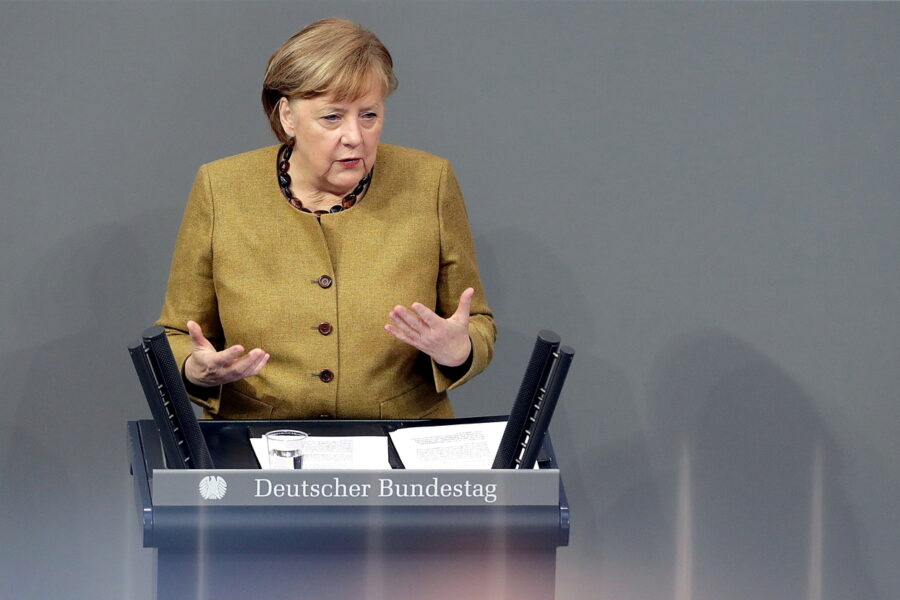 German Chancellor Angela Merkel delivers a speech during a meeting of the German federal parliament, Bundestag, at the Reichstag building in Berlin, Germany, Thursday, Feb. 11, 2021. (AP Photo/Michael Sohn)