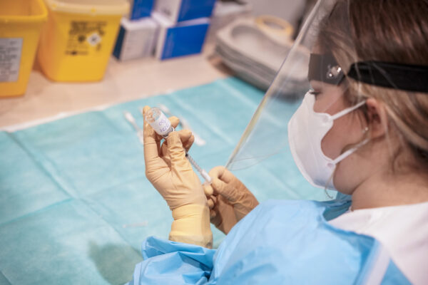 A health worker prepares a dose of the Moderna COVID-19 vaccine to be administrated to over eighty-year-olds, at a vaccine center in Rome’s Auditorium, Monday, Feb. 15, 2021. Moderna is one of the three vaccines authorized by the European Medicines Agency for use in the 27-nation bloc, the other two are Pfizer-BioNtech and AstraZeneca. (AP Photo/Andrew Medichini)