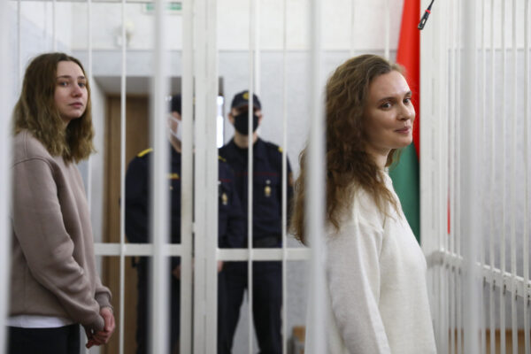Journalists Katsiaryna Andreyeva, right, and Daria Chultsova stand inside a defendants’ cage in a court room in Minsk, Belarus, Thursday, Feb. 18, 2021. A court in Belarus on Thursday sent two female journalists to prison for years on charges of violating public order after they covered a protest against the nation’s authoritarian president. The court in the Belarusian capital of Minsk on Thursday handed two-year sentences to Katsiaryna Andreyeva and Daria Chultsova of the Belsat TV channel. (AP Photo)