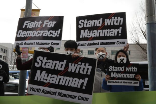 Members of youth group hold signs during a rally against the military coup and supporting Myanmar’s democracy near the Myanmar embassy in Seoul, South Korea, Friday, Feb. 5, 2021. (AP Photo/Lee Jin-man)