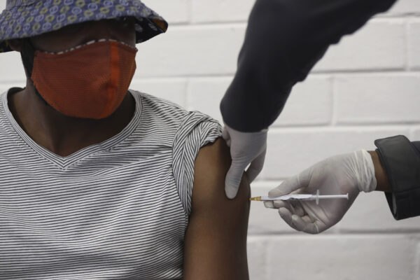 A vaccine volunteer gets an injection at the Chris Hani Baragwanath hospital in Soweto, Johannesburg Wednesday, June 24, 2020. Africa’s first participation in a COVID-19 vaccine trial has begun as volunteers received injections developed at the University of Oxford in Britain. The large-scale trial is being conducted in South Africa, Britain and Brazil. (AP Photo/Siphiwe Sibeko) A vaccine volunteer gets an injection at the Chris Hani Baragwanath hospital in Soweto, Johannesburg Wednesday, June 24, 2020. Africa’s first participation in a COVID-19 vaccine trial has begun as volunteers received injections developed at the University of Oxford in Britain. The large-scale trial is being conducted in South Africa, Britain and Brazil. (AP Photo/Siphiwe Sibeko)