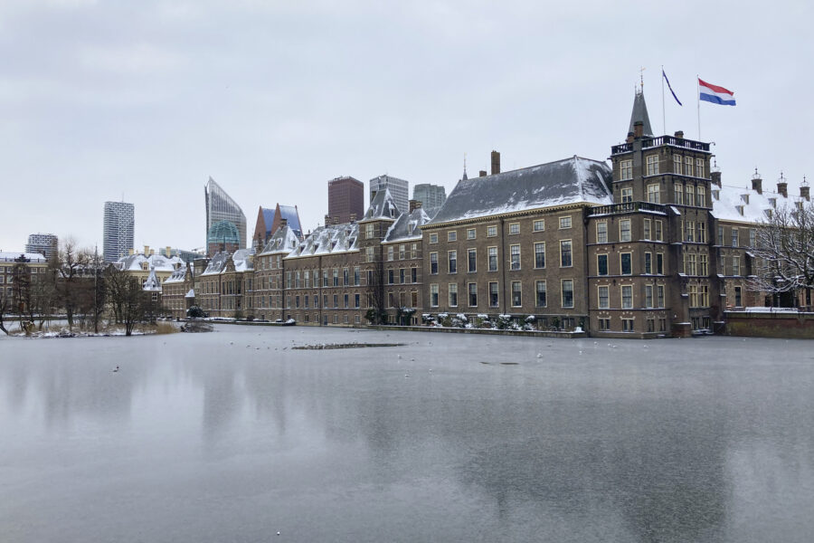 The frozen Hofvijver pond is seen outside the Dutch parliament buildings in The Hague, Netherlands, Tuesday, Feb. 9, 2021. With freezing temperatures forecast for more than a week in the Netherlands, ice fever is sweeping the nation, offering a welcome respite from grim coronavirus news while also creating a challenge for authorities trying to uphold social distancing measures. (AP Photo/Mike Corder)