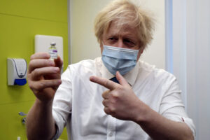 Britain’s Prime Minister Boris Johnson holds a vial of the AstraZeneca vaccine during a visit to a coronavirus vaccination centre at the Health and Well-being Centre in Orpington, south-east London, Monday, Feb. 15, 2021. (Jeremy Selwyn/Pool Photo via AP) Britain’s Prime Minister Boris Johnson holds a vial of the AstraZeneca vaccine during a visit to a coronavirus vaccination centre at the Health and Well-being Centre in Orpington, south-east London, Monday, Feb. 15, 2021. (Jeremy Selwyn/Pool Photo via AP)