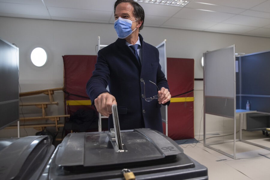 Dutch caretaker Prime Minster Mark Rutte casts his vote in a general election in The Hague, Wednesday, March 17, 2021. Polling stations have opened opened across the Netherlands from Monday in a general election that has been spread over three days to allow people to vote safely during the coronavirus pandemic. (AP Photo/Peter Dejong, Pool)