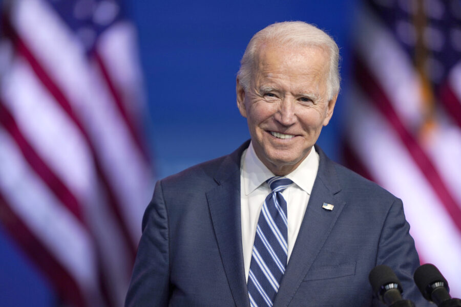 President-elect Joe Biden pauses to smile as listens to media questions at The Queen theater, Tuesday, Nov. 10, 2020, in Wilmington, Del. (AP Photo/Carolyn Kaster)