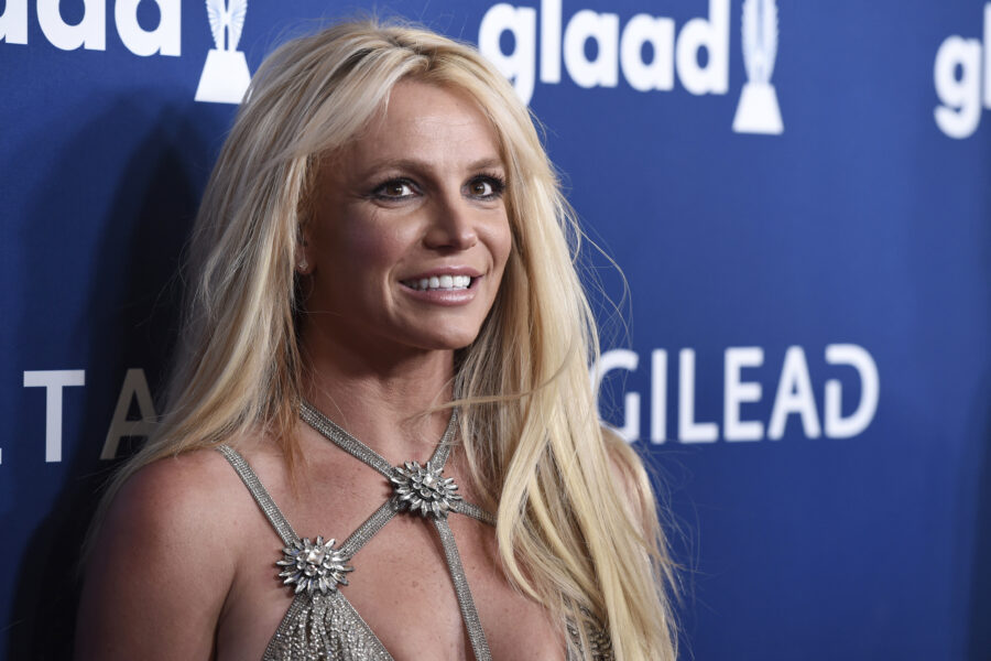 FILE – Britney Spears arrives at the 29th annual GLAAD Media Awards on April 12, 2018, in Beverly Hills, Calif. Spears has asked to address the court to talk about the conservatorship that controls her life and finances. A Los Angeles judge on Tuesday, April 27, 2021, set a June hearing to hear from Spears. (Photo by Chris Pizzello/Invision/AP, File)