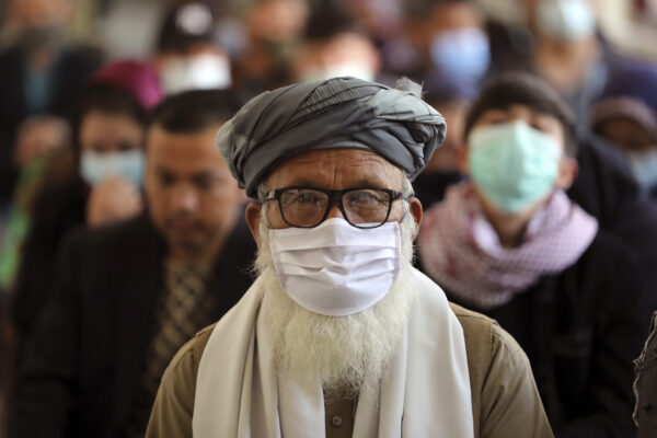 Afghan people wait to receive the Indian version of the AstraZeneca coronavirus vaccine at a hospital in Kabul, Afghanistan, Tuesday, May 11, 2021. (AP Photo/Rahmat Gul)