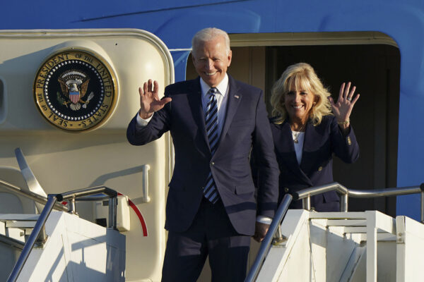 US President Joe Biden and First Lady Jill Biden wave as they arrive aboard Air Force One at RAF Mildenhall, England, ahead of the G7 summit in Cornwall, Wednesday June 9, 2021.  Biden will attend the G7 summit in Cornwall, southwest England. (Joe Giddens/Pool via AP)