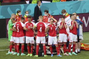 Denmark’s players react as their teammate Christian Eriksen lays on the ground during the Euro 2020 soccer championship group B match between Denmark and Finland at Parken stadium in Copenhagen, Denmark, Saturday, June 12, 2021. (Wolfgang Rattay/Pool via AP) Denmark’s players react as their teammate Christian Eriksen lays on the ground during the Euro 2020 soccer championship group B match between Denmark and Finland at Parken stadium in Copenhagen, Denmark, Saturday, June 12, 2021. (Wolfgang Rattay/Pool via AP)