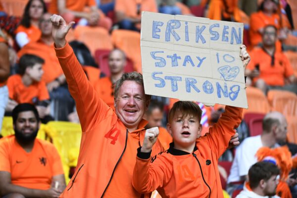 Netherlands supporters hold a placard referring to Denmark’s Christian Eriksen before the Euro 2020 soccer championship group C match between Netherlands and Ukraine at the Johan Cruyff ArenA, Amsterdam, Netherlands, Sunday, June 13, 2021. (Piroschka van de Wouw/Pool via AP)