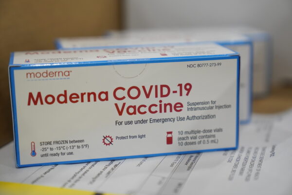 Boxes containing the Moderna COVID-19 vaccine are prepared to be shipped at the McKesson distribution center in Olive Branch, Miss., Sunday, Dec. 20, 2020. (AP Photo/Paul Sancya, Pool)