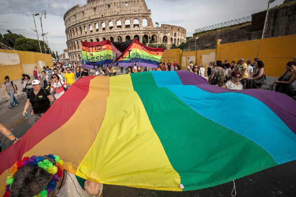 Participants carry a giant rainbow flag, a symbol of the gay rights movement, as they take part in the 22nd annual Gay Pride Parade in Rome, Italy on June 11, 2016. Tens of thousands of members of Italian LGBTQI (Lesbian, Gay, Bisexual, Transgender, Queer and Intersex) communities and supporters of gay rights take part in the annual Gay Pride Parade in downtown Rome to demand legal rights for same-sex couples and against homophobia.(Photo by Giuseppe Ciccia/NurPhoto via Getty Images)