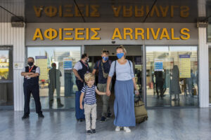 Tourists, arrive at Nikos Kazatzakis International Airport in Heraklion, Crete island, Greece, on Wednesday, July 1, 2020. The passengers most of them from Germany who came from Hamburg, with the first international flight to arrive in the island. Regional airports across Greece, including their tourist destination islands, began accepting direct international flights again on Wednesday, for the first time since flights were banned as part of the country’s lockdown to prevent the spread of the coronavirus.  (AP Photo/ Harry Nakos )