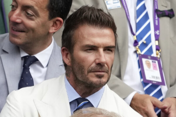 Former soccer star David Beckham waits for the men’s singles semifinals match to begin on day eleven of the Wimbledon Tennis Championships in London, Friday, July 9, 2021. (AP Photo/Alberto Pezzali)