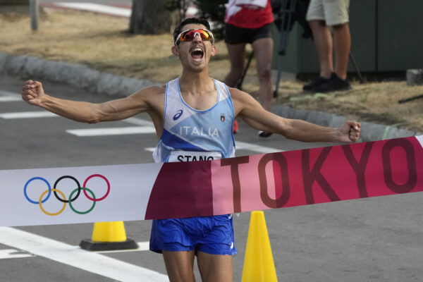 Massimo Stano, of Italy, crosses the finish line to win the men’s 20km race walk at the 2020 Summer Olympics, Thursday, Aug. 5, 2021, in Sapporo, Japan. (AP Photo/Shuji Kajiyama)