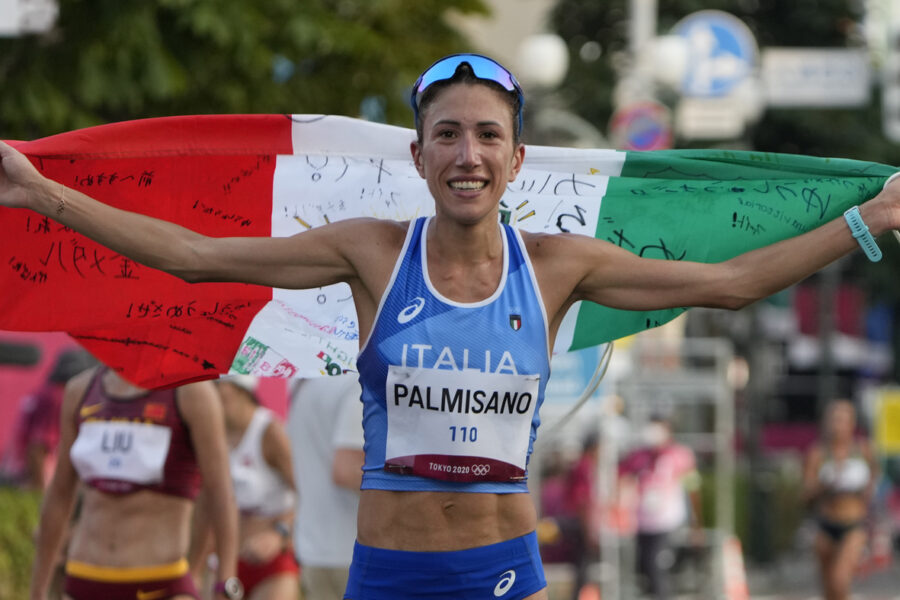 Antonella Palmisano of Italy holds the Italian flag after winning in the women’s 20km race walk at the 2020 Summer Olympics, Friday, Aug. 6, 2021, in Sapporo, Japan. (AP Photo/Shuji Kajiyama)