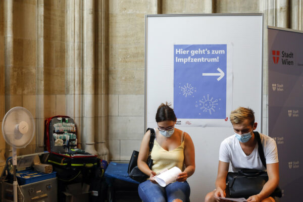 People wait and read the patient information before receiving the Pfizer COVID-19 vaccine against the new coronavirus in one of Austria’s most iconic. buildings, the St. Stephan’s Cathedral in Vienna, Austria, Friday, Aug. 13, 2021. (AP Photo/Lisa Leutner) People wait and read the patient information before receiving the Pfizer COVID-19 vaccine against the new coronavirus in one of Austria’s most iconic. buildings, the St. Stephan’s Cathedral in Vienna, Austria, Friday, Aug. 13, 2021. (AP Photo/Lisa Leutner)