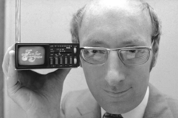 FILE  – In this Sept. 18, 1977 file photo, Clive Sinclair, founder of Sinclair Radionics, a New York-based firm, displays the Microvision television in New York. Sinclair, the British inventor and entrepreneur who arguably did more than anyone else to inspire a generation of children into a life-long passion for computers and gaming, has died. He was 81. Sinclair, who rose to prominence in the early 1980s with a series of affordable home computers that offered millions their first glimpse into the world of coding as well as the adrenaline rush of playing games on screens, died on Thursday, Sept. 17, 2021 morning after a long illness with cancer. (AP Photo/Dave Pickoff, File)