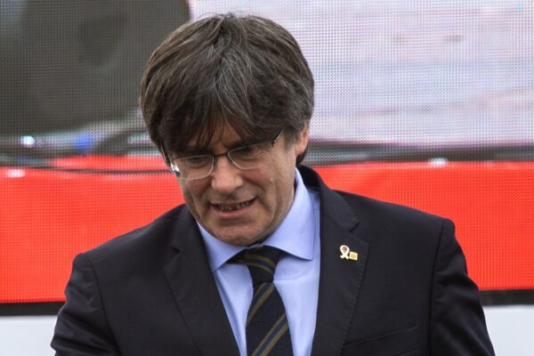 Catalonia’s former regional president Carles Puigdemont thumbs up to the crowd during a political rally in Perpignan, southwestern France, Saturday, 29, 2020. Tens of thousands of people who want the Catalonia region to become independent from Spain on Saturday held a major rally across the border, in southeastern France. (AP Photo/Emilio Morenatti)