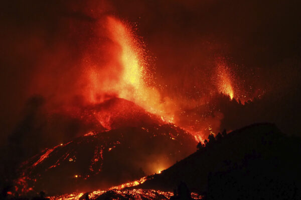 Lava flows from an eruption of a volcano near El Paso on the island of La Palma in the Canaries, Spain, Sunday, Sept. 19, 2021. Lava continues to flow slowly from a volcano that erupted in Spain’s Canary Islands off northwest Africa. The head of the islands’ regional government says Monday he expects no injuries to people in the area after some 5,000 were evacuated. (Europa Press via AP)