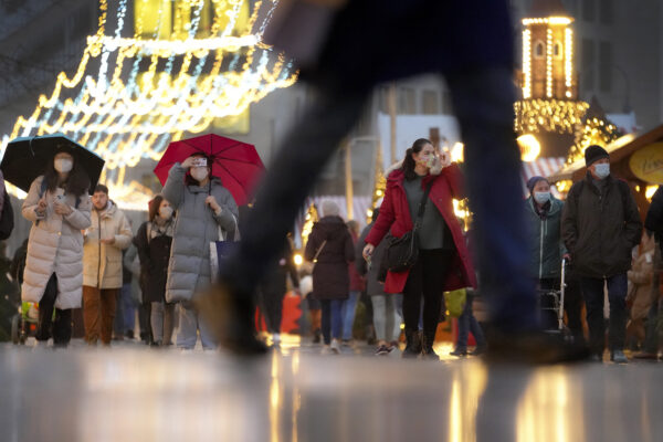 People visit the Christmas market at the ‘Breitscheidplatz’ (Breitscheid Square) in Berlin, Germany, Monday, Dec. 13, 2021. According to Berlin’s coronavirus rules only vaccinated people or people who recovered from a coronavirus infection are allowed to access the Christmas market at the at the bottom of the Kaiser Wilhelm Memorial Church in the German capital. (AP Photo/Michael Sohn) People visit the Christmas market at the ‘Breitscheidplatz’ (Breitscheid Square) in Berlin, Germany, Monday, Dec. 13, 2021. According to Berlin’s coronavirus rules only vaccinated people or people who recovered from a coronavirus infection are allowed to access the Christmas market at the at the bottom of the Kaiser Wilhelm Memorial Church in the German capital. (AP Photo/Michael Sohn)