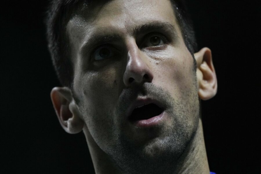 Serbia’s Novak Djokovic grimaces as he plays Croatia’s Marin Cilic during their Davis Cup tennis semi-final match at Madrid Arena in Madrid, Spain, Friday, Dec. 3, 2021. (AP Photo/Bernat Armangue)