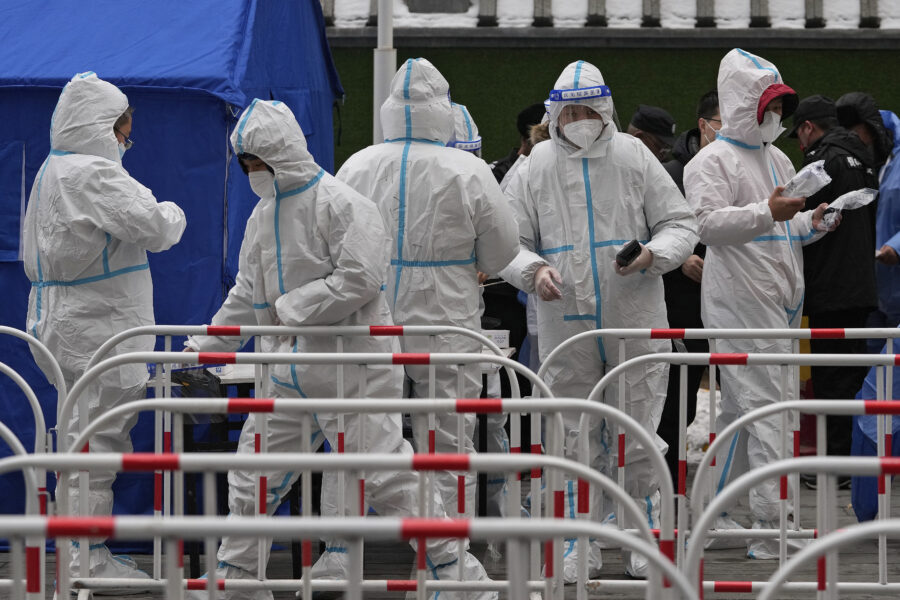Medical workers prepare to administer coronavirus tests at a mass testing site in Beijing, Monday, Jan. 24, 2022. Chinese authorities have lifted a monthlong lockdown of Xi’an and its 13 million residents as infections subside ahead of the Winter Olympics. Meanwhile, the 2 million residents of one Beijing district are being tested following a series of cases in the capital. (AP Photo/Andy Wong)