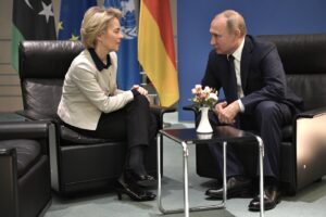 Russian President Vladimir Putin, right, and European Commission President Ursula von der Leyen talk to each other during their meeting on the sideline of a conference on Libya at the chancellery in Berlin, Germany, Sunday, Jan. 19, 2020. German Chancellor Angela Merkel hosts the one-day conference of world powers on Sunday seeking to curb foreign military interference, solidify a cease-fire and help relaunch a political process to stop the chaos in the North African nation. (Alexei Nikolsky, Sputnik, Kremlin Pool Photo via AP)