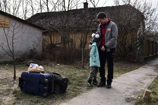People fleeing from Ukraine arrive at a temporary shelter run by the municipality and the Baptist Charity in Tiszabecs, Hungary, Firday, March 4, 2022. More than 1 million people have fled Ukraine following Russia’s invasion in the swiftest refugee exodus in this century, the United Nations said Thursday. (AP Photo/Anna Szilagyi)