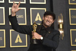 Troy Kotsur, winner of the award for best performance by an actor in a supporting role for “CODA,” poses in the press room at the Oscars on Sunday, March 27, 2022, at the Dolby Theatre in Los Angeles. (Photo by Jordan Strauss/Invision/AP)