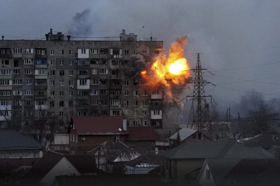 An explosion is seen in an apartment building after Russian’s army tank fires in Mariupol, Ukraine, Friday, March 11, 2022. (AP Photo/Evgeniy Maloletka)