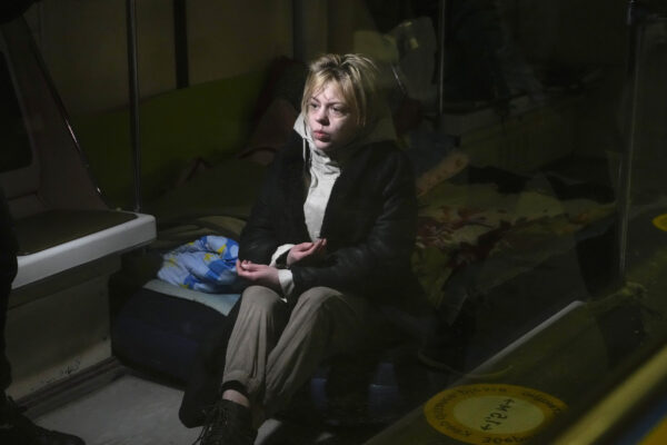 Anna, an English Language school teacher from Nova Kakhovka occupied by the Russian troops, sits in a subway train carriage being used as a bomb shelter, together with many city residents in Kyiv, Ukraine, Sunday, March 13, 2022. (AP Photo/Efrem Lukatsky)