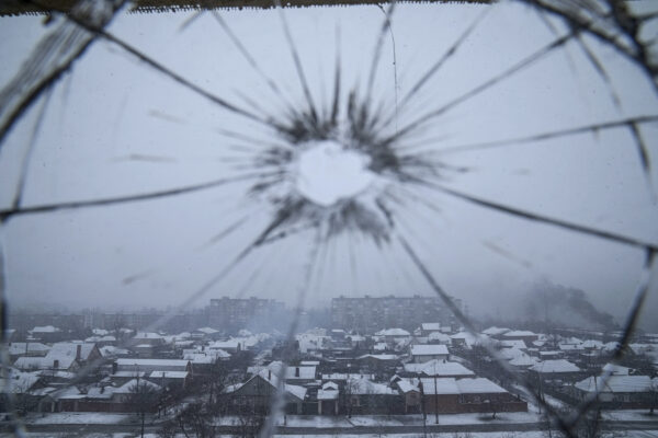 A hospital window is cracked from shelling in Mariupol, Ukraine, Thursday, March 3, 2022. (AP Photo/Evgeniy Maloletka)