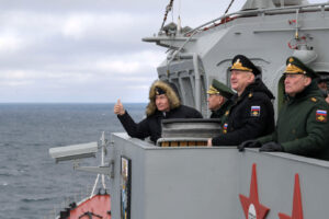 Russian President Vladimir Putin, left, Defense Minister Sergei Shoigu, second left, Commander-in-Chief of the Russian Navy Nikolai Yevmenov, second right, Commander of the Southern Military District troops Alexander Dvornikov, right, watch a navy exercise from the Marshal Ustinov missile cruiser in the Black Sea, Crimea, Thursday, Jan. 9, 2020. The drills involved warships and aircraft that launched missiles at practice targets. (Alexei Druzhinin, Sputnik, Kremlin Pool Photo via AP)