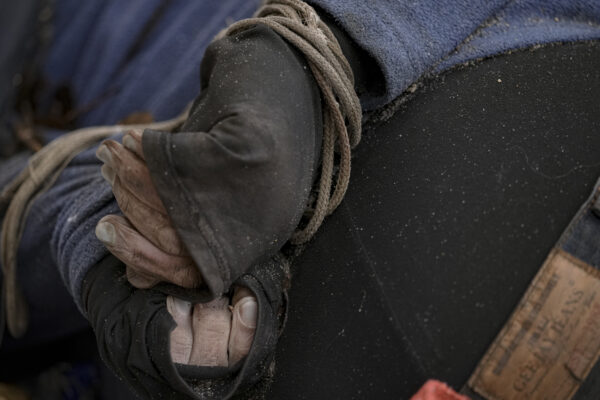A lifeless body of a man with his hands tied behind his back lies on the pavement in Bucha, Ukraine, Sunday, April 3, 2022. Associated Press journalists in Bucha, a small city northwest of Kyiv, saw the bodies of at least nine people in civilian clothes who appeared to have been killed at close range. At least two had their hands tied behind their backs.(AP Photo/Vadim Ghirda)