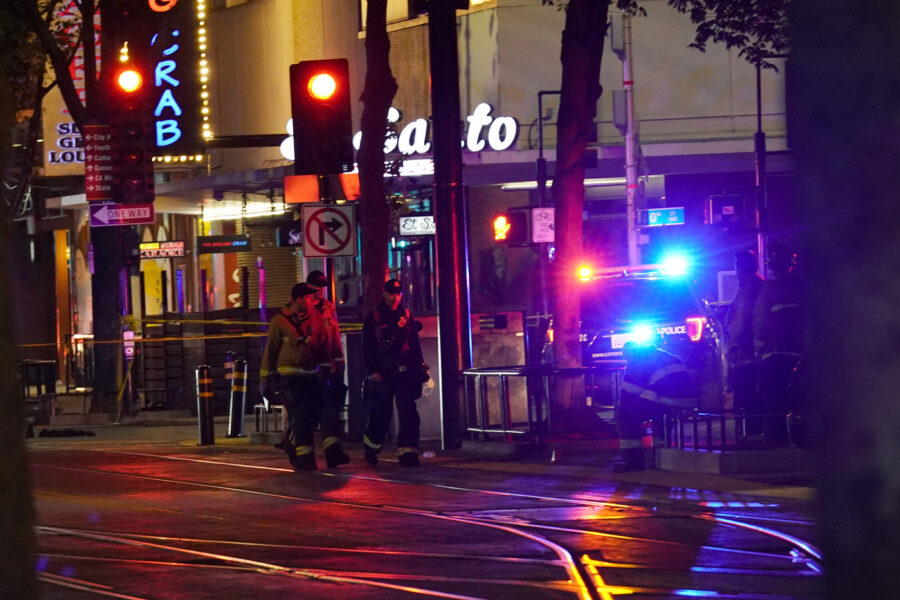 Emergency personnel walk near the scene of an apparent mass shooting in Sacramento, Calif., Sunday, April 3, 2022. (AP Photo/Rich Pedroncelli)