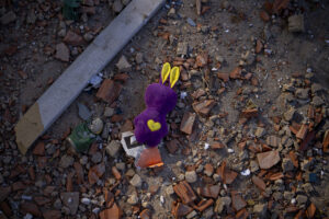 A toy amongst the debris near an apartment building damaged following a rocket attack, in Kyiv, Ukraine, Saturday, Feb. 26, 2022. (AP Photo/Emilio Morenatti)