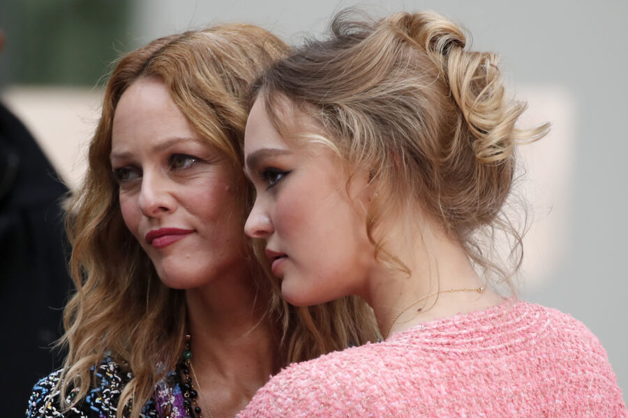 French actress and singer Vanessa Paradis, left, and actress Lily-Rose Depp pose before the presentation of Chanel Spring-Summer 2021 fashion collection, Tuesday, Oct. 6, 2020 in Paris. (AP Photo/Francois Mori)