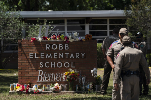 Flowers and candles are placed outside Robb Elementary School in Uvalde, Texas, Wednesday, May 25, 2022, to honor the victims killed in Tuesday’s shooting at the school. Desperation turned to heart-wrenching sorrow for families of grade schoolers killed after an 18-year-old gunman barricaded himself in their Texas classroom and began shooting, killing several fourth-graders and their teachers. (AP Photo/Jae C. Hong)
Flowers and candles are placed outside Robb Elementary School in Uvalde, Texas, Wednesday, May 25, 2022, to honor the victims killed in Tuesday’s shooting at the school. Desperation turned to heart-wrenching sorrow for families of grade schoolers killed after an 18-year-old gunman barricaded himself in their Texas classroom and began shooting, killing at least 19 fourth-graders and their two teachers. (AP Photo/Jae C. Hong)