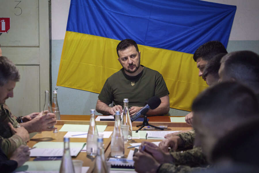 In this photo provided by the Ukrainian Presidential Press Office on Saturday, June 18, 2022, Ukrainian President Volodymyr Zelenskyy attends meeting with military officials as he visits the war-hit Mykolaiv region. (Ukrainian Presidential Press Office via AP)