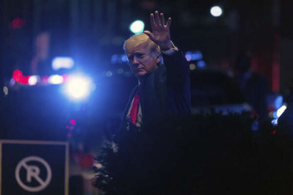 Former President Donald Trump walks into Trump Tower, late Tuesday, Aug. 9, 2022, in New York. (AP Photo/Yuki Iwamura)