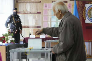 A man casts his ballot during a referendum in Luhansk, Luhansk People’s Republic controlled by Russia-backed separatists, eastern Ukraine, Tuesday, Sept. 27, 2022. Voting began Friday in four Moscow-held regions of Ukraine on referendums to become part of Russia. (AP Photo)