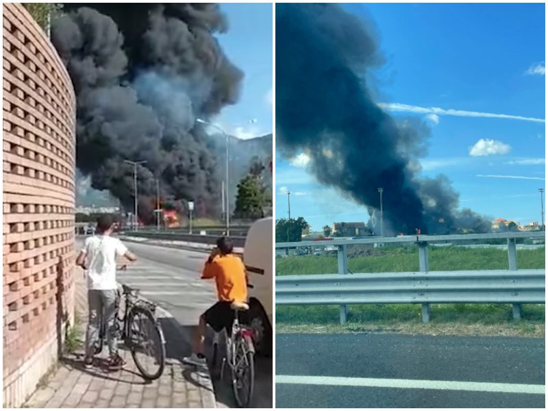 A fuoco rimessa di camion, incendio enorme minaccia i palazzi: “Evacuate, è pericoloso”
