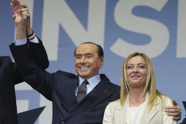 FILE – Forza Italia’s Silvio Berlusconi, and Brothers of Italy’s Giorgia Meloni attend the center-right coalition closing rally in Rome Thursday, Sept. 22, 2022. Italy’s President Sergio Mattarella started formal consultations with political leaders Thursday, Oct. 20, 2022, with the aim of quickly giving the country a new government, which is expected to be the country’s first led by the far right since the end of World War II. (AP Photo/Gregorio Borgia, File)
