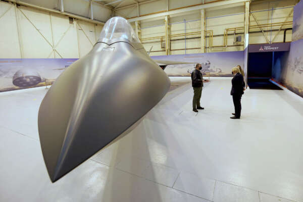 Britain’s Prime Minister Boris Johnson is shown around the Team Tempest facility, during a visit to BAE Systems at Warton Aerodrome in Lancashire, England, Monday, March 22, 2021 to mark the publication of the Integrated Review and the Defence White Paper. (Christopher Furlong/Pool Photo via AP)