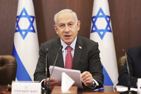 Israeli Prime Minister Benjamin Netanyahu attends the weekly cabinet meeting at the prime minister’s office in Jerusalem Sunday, March 19, 2023. (Abir Sultan/Pool Photo via AP)
